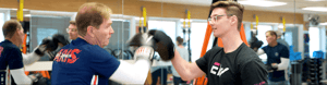Patient with Parkinson's Disease doing a punching exercise during physical therapy.