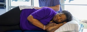 Woman receiving manual therapy for lower back pain during a physical therapy session to reduce pain, improve mobility, and support recovery.