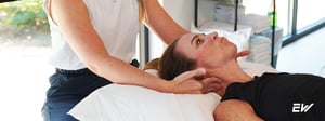 Woman receiving physical therapy for neck pain, undergoing hands-on manual therapy to improve mobility and reduce discomfort.