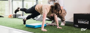 Person performing a supervised core stability exercise as part of treatment for core instability and weakness.