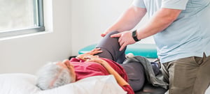 EW Motion Therapy physical therapist performing knee and hip manual therapy on senior patient — orthopedic physical therapy in Homewood Alabama.