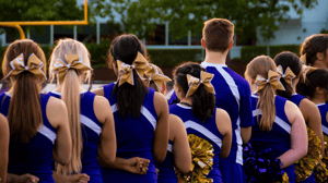 From behind, a row of cheerleaders in a line