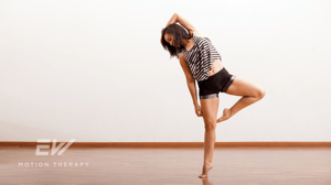 A female contemporary dancer alone in a studio