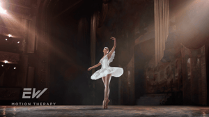 A ballerina turns on stage.