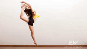 A dancer leaps up into the air.
