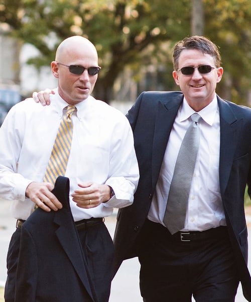 Co-founders of EW Motion Therapy walking together outdoors in Birmingham Alabama.