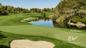 A well-maintained golf course on a sunny day.