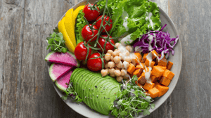 A plate of fruits and vegetables.