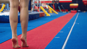 A gymnast prepares to do a floor routine.