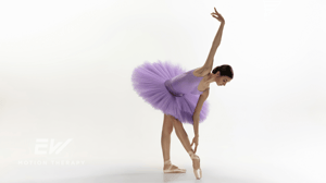 A ballet dancer in a purple tutu