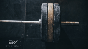 A barbell on the gym floor.