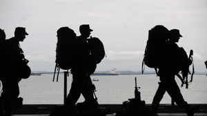 Army soldiers in silhouette.