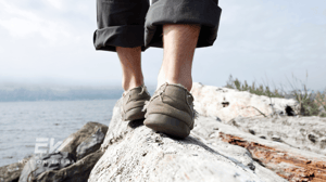 Feet balancing on a rock