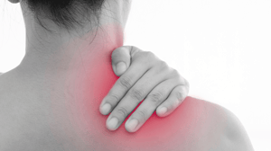 From behind, a woman grips her shoulder.