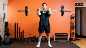 A man lifts a dumbbell.