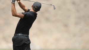 A golfer immediately after a swing.