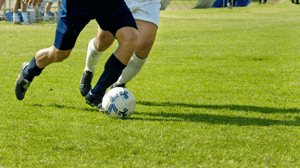 Two soccer players on the field