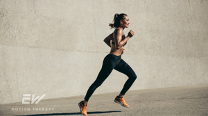 A woman runs along a street.