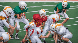 High school football players line up for a play.