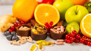 An array of colorful fruits and vitamin supplements.